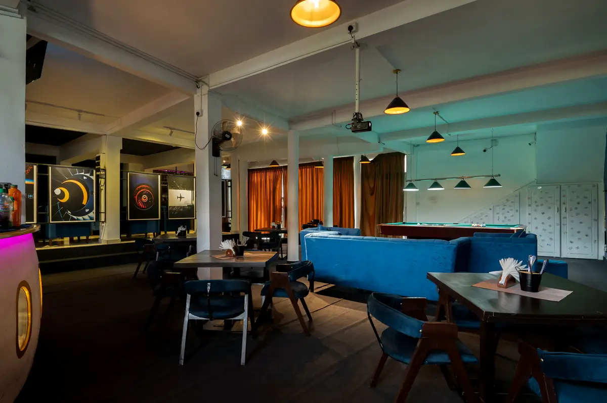 Bar floor with dining tables and pool table
