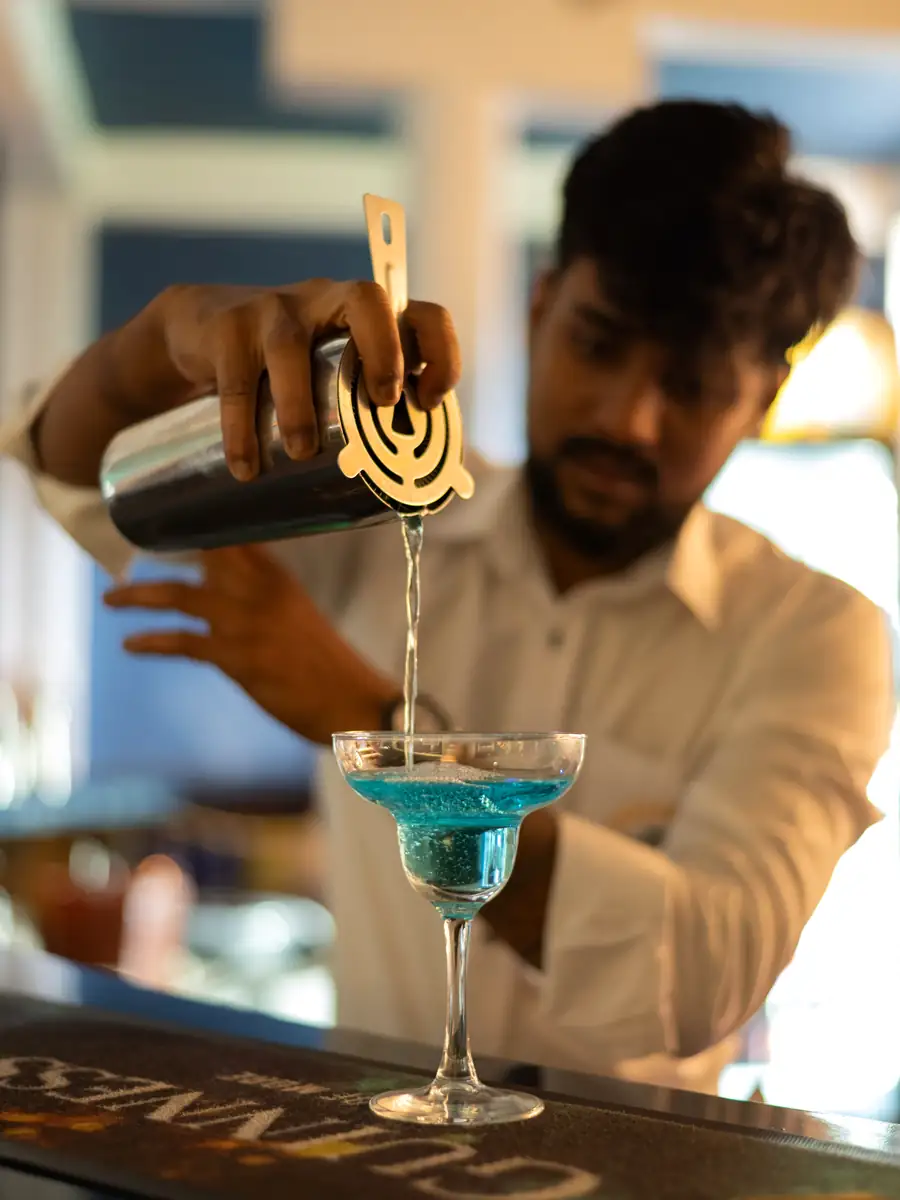 Bartender pouring a signature cocktail