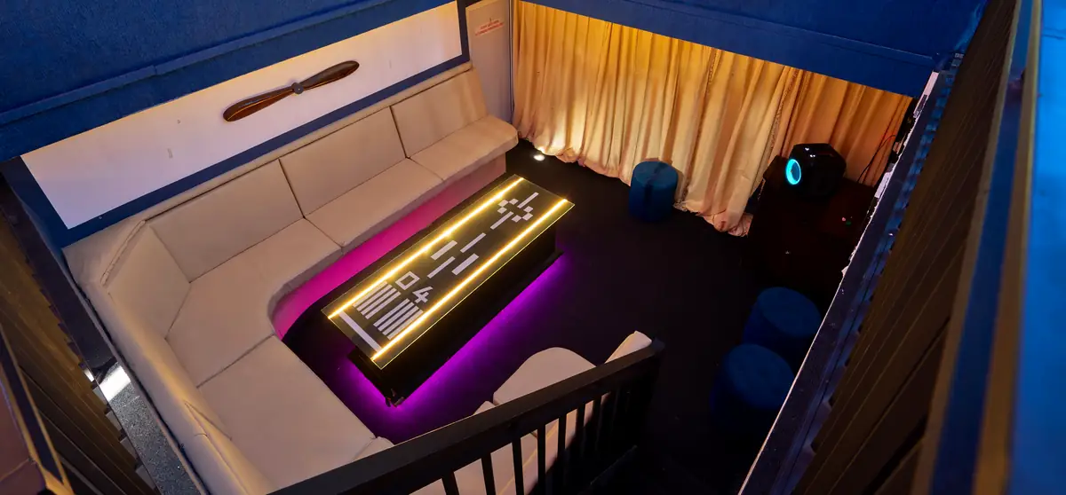 Private karaoke and VIP room with runway-light table