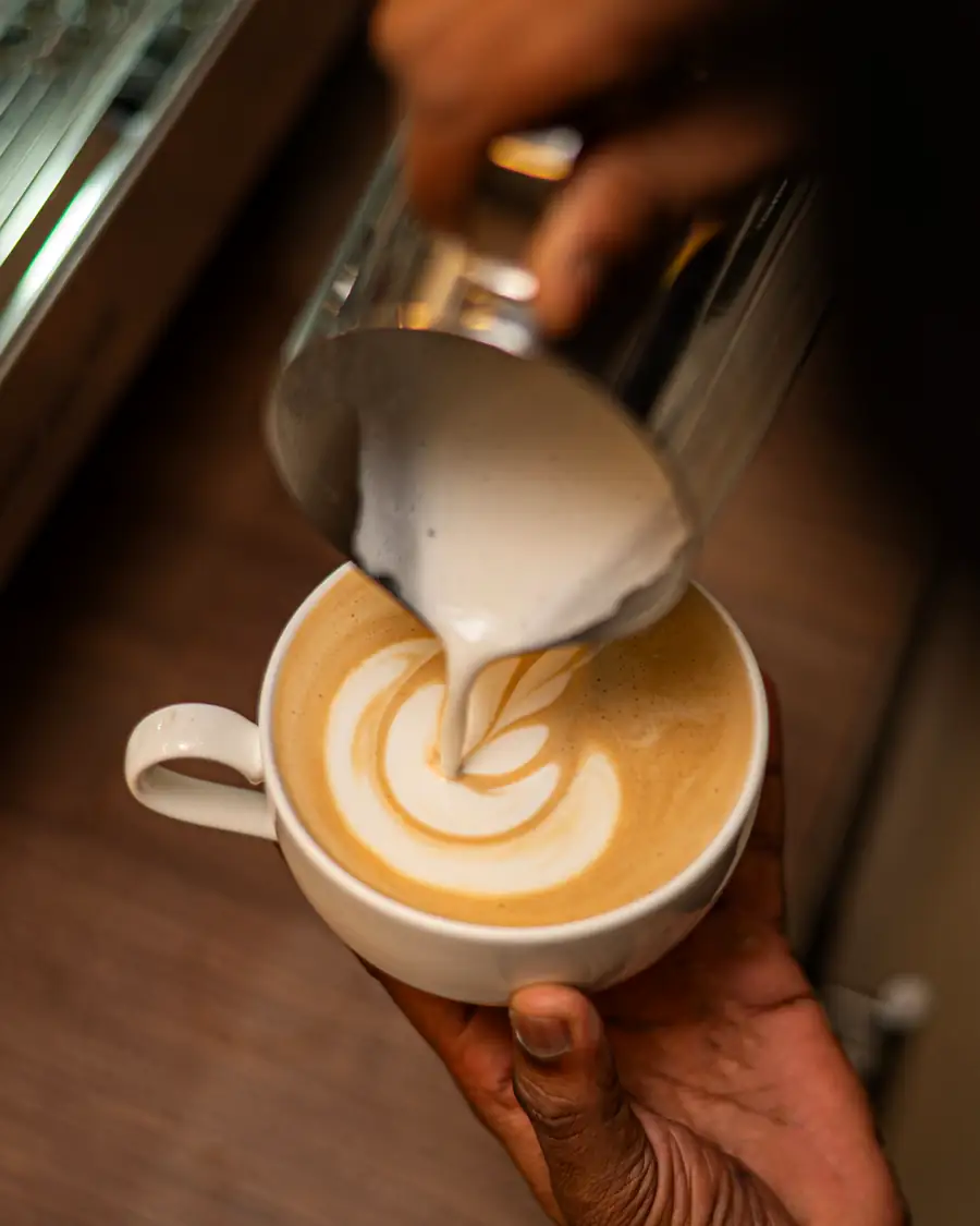 Latte art poured at the cafe